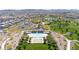 Aerial view of community pool and park with splash pad, picnic areas, and walking paths in a well-maintained neighborhood at 717 Monroe Hill Pl, Henderson, NV 89011