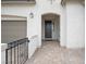 Welcoming front entrance with a cozy covered patio, offering a seamless blend of style at 717 Monroe Hill Pl, Henderson, NV 89011