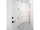 Bright hallway featuring wood-look tile flooring and access to other rooms in this beautifully designed home at 717 Monroe Hill Pl, Henderson, NV 89011