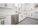 Contemporary kitchen featuring white cabinetry, stainless steel appliances, and stylish backsplash at 717 Monroe Hill Pl, Henderson, NV 89011