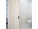 Bright powder room with hexagon tile floors and toilet at 717 Monroe Hill Pl, Henderson, NV 89011