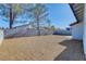 Large backyard is surrounded by block walls and features rock landscaping for easy maintenance at 7405 Saybrook Point Dr, Las Vegas, NV 89128