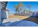 Spacious backyard with patio, rock landscaping, and block walls, perfect for outdoor living at 7405 Saybrook Point Dr, Las Vegas, NV 89128