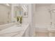 Bright bathroom featuring a vanity with a stone countertop and a shower/tub combo at 7405 Saybrook Point Dr, Las Vegas, NV 89128