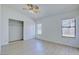 Bedroom features wood-look floors, ceiling fan, and a closet at 7405 Saybrook Point Dr, Las Vegas, NV 89128