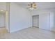Well lit bedroom showing closet with sliding doors and wood-look floors at 7405 Saybrook Point Dr, Las Vegas, NV 89128