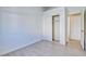 A well-lit bedroom featuring wood-look floors and a closet with sliding doors at 7405 Saybrook Point Dr, Las Vegas, NV 89128
