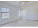 Open bedroom boasts wood-look floors, neutral walls, and natural light at 7405 Saybrook Point Dr, Las Vegas, NV 89128