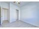 Bright bedroom featuring new flooring, a ceiling fan and closet at 7405 Saybrook Point Dr, Las Vegas, NV 89128