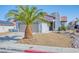 Well-maintained home with rock landscaping, a two-car garage, and a charming front entrance at 7405 Saybrook Point Dr, Las Vegas, NV 89128