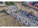 Charming front yard featuring a decorative bridge, rock garden, and low-maintenance landscaping at 7405 Saybrook Point Dr, Las Vegas, NV 89128