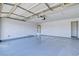 An empty garage with a painted floor and white walls at 7405 Saybrook Point Dr, Las Vegas, NV 89128