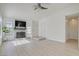 Bright living room features a fireplace, updated flooring, and plenty of natural light at 7405 Saybrook Point Dr, Las Vegas, NV 89128