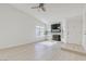 Open living room featuring a fireplace, lots of windows and new flooring at 7405 Saybrook Point Dr, Las Vegas, NV 89128
