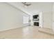 Bright living room featuring a fireplace, lots of windows and new flooring at 7405 Saybrook Point Dr, Las Vegas, NV 89128