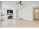 Bright living room features a fireplace, updated flooring, and plenty of natural light at 7405 Saybrook Point Dr, Las Vegas, NV 89128