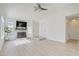Bright living room features a fireplace, updated flooring, and plenty of natural light at 7405 Saybrook Point Dr, Las Vegas, NV 89128
