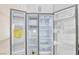A clean, well-lit, side-by-side refrigerator with open doors showing adjustable shelves at 7405 Saybrook Point Dr, Las Vegas, NV 89128