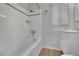 Bathroom featuring a white tub and subway tile surround with updated vanity at 75 N 27Th St, Las Vegas, NV 89101