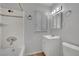 Bathroom featuring a white tub with white subway tile surround and white vanity at 75 N 27Th St, Las Vegas, NV 89101