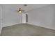 A well-lit bedroom with a ceiling fan, soft carpet and neutral walls at 75 N 27Th St, Las Vegas, NV 89101