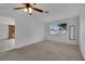 Bright bedroom with plush carpet and views of a cozy fireplace in the nearby living room at 75 N 27Th St, Las Vegas, NV 89101