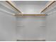 Empty walk-in closet featuring white walls and wood shelving for ample storage space at 75 N 27Th St, Las Vegas, NV 89101
