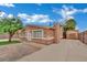 Quaint single-story exterior with mature landscaping, a detached garage and a 'Beware of Dog' sign at 75 N 27Th St, Las Vegas, NV 89101