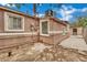 Exterior shot shows the side of the home, with brick pavers, a window A/C unit and secure access at 75 N 27Th St, Las Vegas, NV 89101