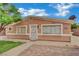 Charming single-story house with a low wall, decorative door, and well-maintained front yard at 75 N 27Th St, Las Vegas, NV 89101