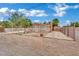 Charming single-story home with a white fence and drought resistant landscaping in the front yard at 75 N 27Th St, Las Vegas, NV 89101