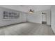 Spacious living room with lots of natural light, tile flooring, and a ceiling fan at 75 N 27Th St, Las Vegas, NV 89101