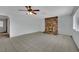 Bright living room featuring a striking stone fireplace, tile floors, and a ceiling fan at 75 N 27Th St, Las Vegas, NV 89101
