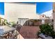 Spacious backyard with stylish patio furniture and a well-maintained brick paved area at 8860 Hampton Green Ave, Las Vegas, NV 89129