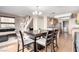 Bright open-plan dining area seamlessly connects to the living room and features stainless steel appliances at 8860 Hampton Green Ave, Las Vegas, NV 89129