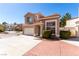 Attractive two-story home with a two-car garage and desert landscaping, set in a neighborhood at 8860 Hampton Green Ave, Las Vegas, NV 89129
