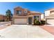 Charming two-story home featuring a well-maintained front yard, and a two car garage with a beautiful tiled roof at 8860 Hampton Green Ave, Las Vegas, NV 89129