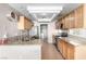 Charming kitchen with stainless steel appliances, tile floors, and granite countertops at 8860 Hampton Green Ave, Las Vegas, NV 89129