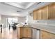 The kitchen flows into the breakfast nook and features stainless steel appliances at 8860 Hampton Green Ave, Las Vegas, NV 89129