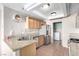 Bright kitchen featuring stainless steel appliances, granite counters, and tiled floors at 8860 Hampton Green Ave, Las Vegas, NV 89129