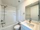 Well-lit bathroom features a shower-tub combination, toilet, and vanity sink at 10879 Artesano Ave, Las Vegas, NV 89135