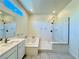 Modern bathroom featuring a soaking tub, glass shower, and sleek, minimalist design at 10879 Artesano Ave, Las Vegas, NV 89135