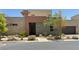 Inviting modern home featuring a colorful exterior, well-maintained landscaping, and a two-car garage at 10879 Artesano Ave, Las Vegas, NV 89135