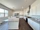 Modern kitchen with stainless appliances, granite counters, a large island, and ample storage at 10879 Artesano Ave, Las Vegas, NV 89135