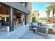 Outdoor seating area with comfortable chairs and a shaded patio at 10879 Artesano Ave, Las Vegas, NV 89135