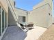 Private outdoor patio with pavers, landscaping, and space for seating and entertaining at 10879 Artesano Ave, Las Vegas, NV 89135