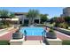 Outdoor pickleball court beautifully landscaped with lush greenery and manicured lawns at 10879 Artesano Ave, Las Vegas, NV 89135