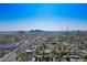 Expansive aerial view of Las Vegas cityscape and surrounding mountains with residential homes below at 1115 Melville Dr, Las Vegas, NV 89102