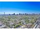 Vibrant aerial view featuring Las Vegas skyline with a residential area showcasing lush greenery and community planning at 1115 Melville Dr, Las Vegas, NV 89102
