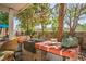 Outdoor living area with built-in grill, brick pavers, and lush greenery at 1115 Melville Dr, Las Vegas, NV 89102